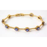 A DIAMOND AND TANZANITE BRACELET