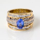 A TRIPLE BAND DIAMOND AND TANZANITE DRESS RING