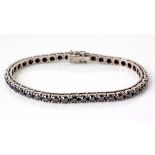 A BLACK DIAMOND TENNIS BRACELET