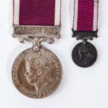 A SOUTH AFRICAN PERMANENT FORCE LONG SERVICE AND GOOD CONDUCT MEDAL WITH MINIATURE