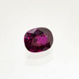 A UNMOUNTED CUSHION-SHAPED MIXED-CUT RUBY