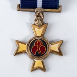 A PRO MERITO DECORATION MINIATURE MEDAL