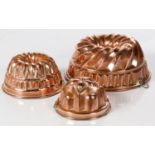 FOUR COPPER JELLY MOULDS