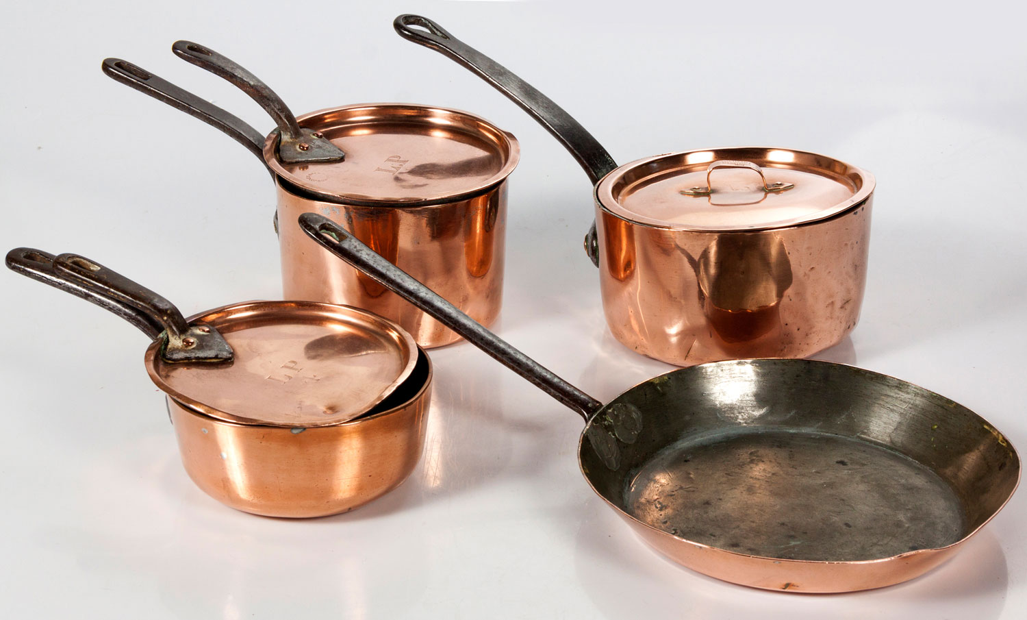 THREE ENGLISH COPPER SAUCEPANS AND COVERS