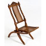 A WALNUT FOLDING CHAIR, 19TH CENTURY