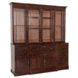 A REGENCY MAHOGANY BREAKFRONT SECRETAIRE BOOKCASE