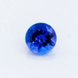 AN UNMOUNTED ROUND MIXED-CUT TANZANITE