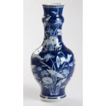 A CHINESE BLUE AND WHITE ‘LOTUS AND BUTTERFLY’ VASE, QING DYNASTY, 19TH CENTURY