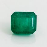 AN UNMOUNTED EMERALD-CUT EMERALD