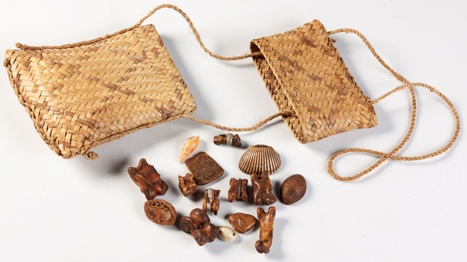 A SHONA DIVINER'S BASKET WITH SET OF BONES, SHELLS, etc.