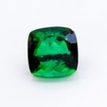 AN UNMOUNTED CUSHION-CUT GREEN TOURMALINE