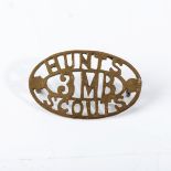 A WWI HUNTS SCOUTS SLOUCH HAT BADGE