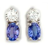 A PAIR OF DIAMOND AND TANZANITE EARRINGS