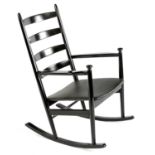 AN EBONISED ROCKING CHAIR, MANUFACTURED BY NIELS EILERSEN, DENMARK, 1960s