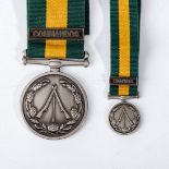 A SANDF CLOSURE COMMEMORATIVE MEDAL WITH COMMANDO BAR AND MINIATURE MEDAL