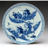 A CHINESE BLUE AND WHITE ‘HUNTSMEN’ PLATE, QING DYNASTY, POSSIBLY KANGXI 1662 – 1722