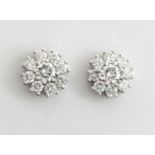 A PAIR OF DIAMOND CLUSTER EARRINGS