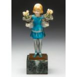AN ART DECO SILVERED BRONZE AND CARVED IVORY GIRL WITH FLOWERS, CIRCA 1920