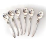 A SET OF SIX SILVER CACTUS PATTERN COFFEE SPOONS, DESIGNED BY GUNDORPH ALBERTUS FOR GEORG JENSEN