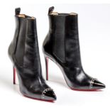 A PAIR OF CHRISTIAN LOUBOUTIN BANJO SPIKED CAP-TOE BOOTIES
