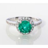 AN EMERALD AND DIAMOND RING