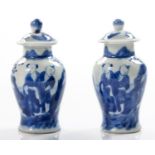 A PAIR OF CHINESE MINIATURE BLUE AND WHITE JARS AND COVERS, QING DYNSASTY, 19TH CENTURY