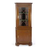 A GEORGE III MAHOGANY CORNER CUPBOARD