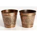 A NEAR PAIR OF DECORATIVE COPPER PLANTERS