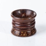 AN ANGLO BOER POW HARDWOOD SERVIETTE RING, BERMUDA