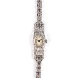 A LADY'S PLATINUM AND DIAMOND WRISTWATCH