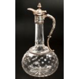 A SILVER-MOUNTED CUT-GLASS CLARET JUG