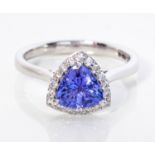 A TANZANITE AND DIAMOND RING, BROWNS