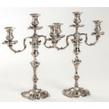 A PAIR OF EDWARDIAN SILVER THREE LIGHT CANDELABRA, HOLLAND, ALDWINCKLE AND SLATER, LONDON, 1902