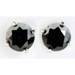 A PAIR OF BLACK DIAMOND EAR STUDS