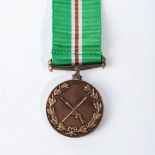 A SOUTH AFRICA HOMELANDS TRANSKEI MILITARY RULE MEDAL Full size with ribbon, COA on reverseThe