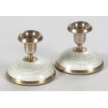 A PAIR OF NORWEGIAN SILVER AND ENAMELLED CANDLESTICKS, DAVID ANDERSEN, NORWAY