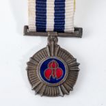 A PRO MERITO DECORATION MINIATURE MEDAL