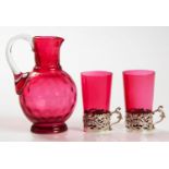 A CRANBERRY GLASS THUMBPRINT JUG, EARLY 20TH CENTURY