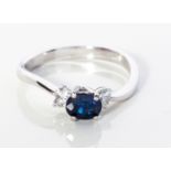 A SAPPHIRE AND DIAMOND RING