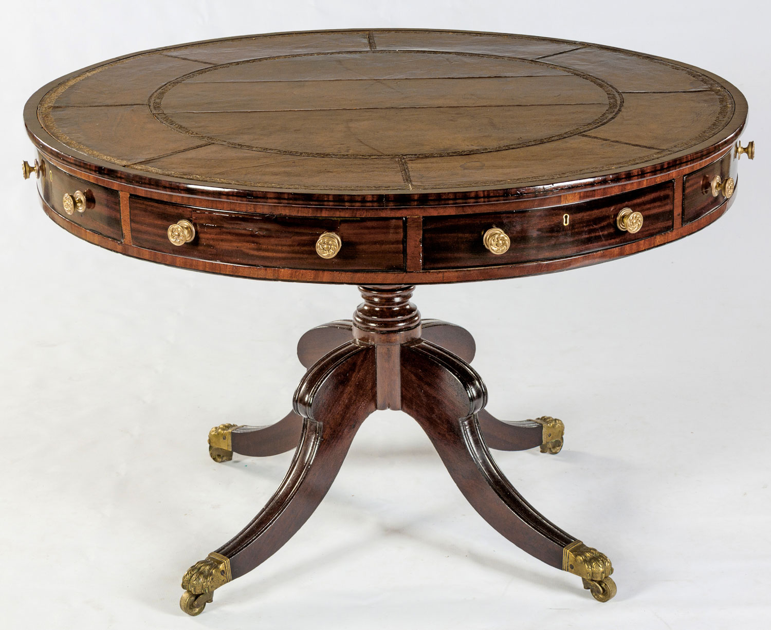 A REGENCY MAHOGANY DRUM TABLE