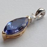 A TANZANITE AND DIAMOND PENDANT