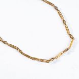 AN 18CT GOLD LONG CHAIN