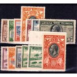 CAYMAN ISLANDS */** 1935 King George V set of 12 plus extra 5/- shade. Mint large part o.g. SG 96-