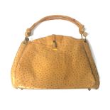 A LIGHT BROWN OSTRICH LEATHER HANDBAG With loose handles, three inner compartments, handles with