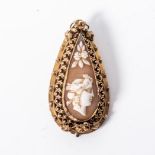 A CAMEO BROOCH bezel set to the centre with an teardrop shape cameo with a Roman Head surrounded