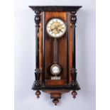 AN EBONISED AND MAHOGANY WALL CLOCK BUYERS ARE ADVISED THAT A SERVICE IS RECOMMENDED FOR ALL
