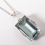 AN AQUAMARINE PENDANT Bezel set with an art deco design weighing approximately 50 carats in 14ct