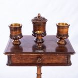 A VICTORIAN SMOKER'S TABLE The rectangular top above a frieze drawer, on a turned tapering