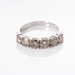 A DIAMOND ETERNITY RING claw set with 6 round brilliant cut diamonds weighing 1,80 carats in