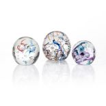 THREE DAVID READE PAPERWEIGHTS In graduating sizes, each with controlled bubbles, signed and dated